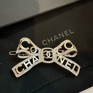 Chanel hair bow accessories. Champagne gold with rhinestones.